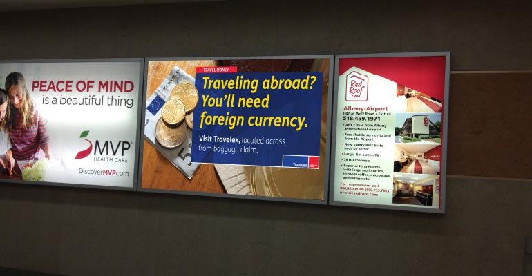 albany airport backlit advertising for travelex currency exchange